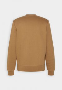 Bruine sweatshirt met een eenvoudig ontwerp, ribbelboorden en zoom. Gemaakt van een zachte stof, met een ronde hals en zonder zichtbare branding.