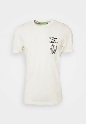 Cremfarbendes Baumwoll-T-Shirt mit kurzen Ärmeln, versehen mit einem schwarzen Grafikdruck von zwei Figuren und dem Text "UNTERSTÜTZE DIE VERLIERER" auf der Brust.
