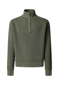 Zaļš ribots džemperis ar augstu apkakli un pusdienu rāvējslēdzēju. Raksturots ar brīvu piegriezumu, fakturētu adījumu un cieši pieguļošiem aprocēm. Nav redzamu logotipu vai rakstu.