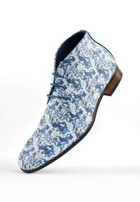 Blue floral-patterned lace-up ankle shoes with a smooth upper and a wooden heel. Features intricate botanical designs in various shades of blue.