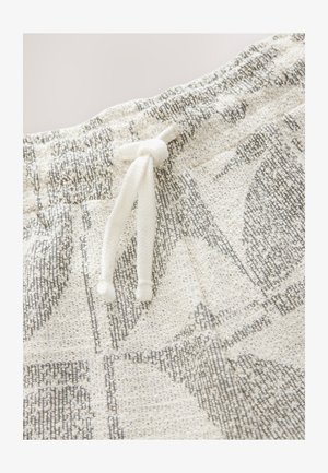 Wit en grijs gemêleerd stof met een gestructureerde afwerking, voorzien van een witte trekkoord voor aanpassing in de taille.