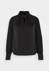 Blouse noire à manches longues avec col montant, détail plissé, découpe en forme de trou de serrure et poignets boutonnés.
