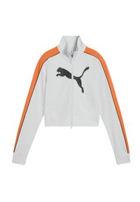 Witte jas met ritssluiting, oranje accenten op de schouders, zwarte zijstrepen en een zwart Puma-logo. Kort model met geribbelde manchetten en kraag.