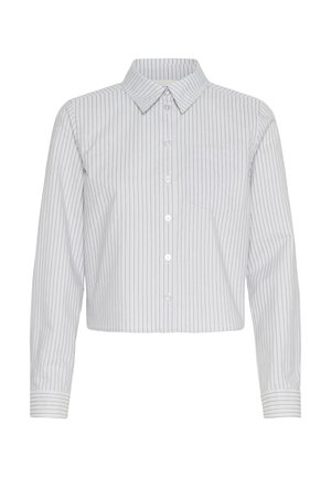 Cropped button-up shirt in white with vertical navy stripes, featuring a collar and a single chest pocket. Long sleeves with cuff detail.