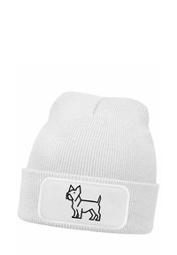 White knit beanie with a cuff, featuring a black outline of a dog in a rectangular patch on the front. Soft texture, snug fit.
