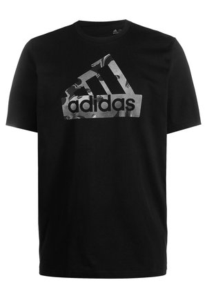 T-shirt noir à manches courtes Adidas avec un grand logo Adidas à motif camouflage centré sur la poitrine.