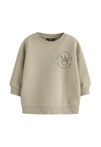 Felpa beige chiaro realizzata in misto cotone. Presenta un collo rotondo, spalle scese e una stampa con "NY" e testo sulla parte anteriore.