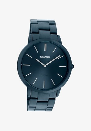 Montre-bracelet en métal bleu foncé avec cadran minimaliste, index argentés, et aiguilles des heures et des minutes argentées indiquant 10h10.