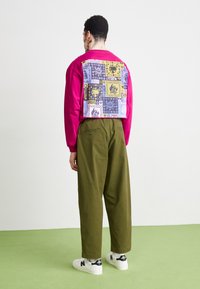 Manastash FLEX CLIMBER WIDE LEG - Pantalon classique - oliv