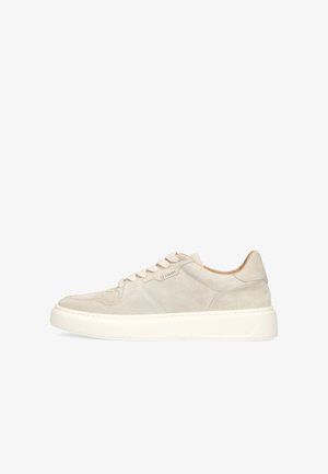 Beige suede low-top sneaker with white thick sole, lace-up front, and subtle brand logo on side.