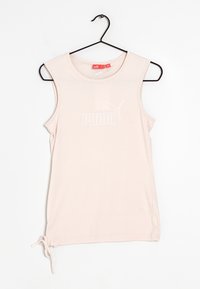 Top senza maniche di un delicato rosa pallido, realizzato in tessuto morbido. Presenta il logo bianco di Puma sul davanti e una parte inferiore arricciata con un dettaglio a fiocco.