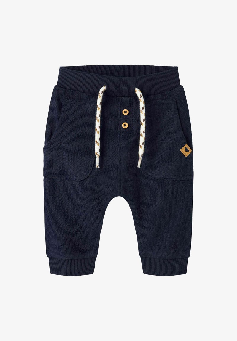 Marineblaue Strickschweißhosen mit zwei Seitentaschen, ausgestattet mit einem gerippten Bund, Zugband und zwei Holzknopf-Akzenten.