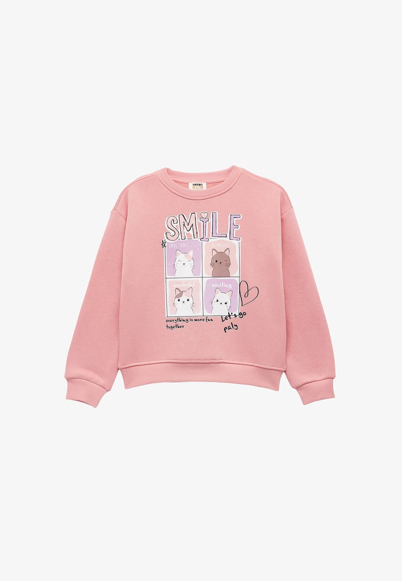 Sudadera rosa con cuello redondo. Presenta un gráfico con animales de dibujos animados y el texto "SONRÍE" en letras grandes. Tejido suave y texturizado.