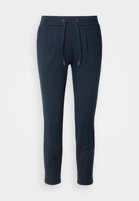 Pantalon de jogging bleu marine en tissu doux, avec une taille élastique, un cordon de serrage, deux poches avant et des jambes fuselées.