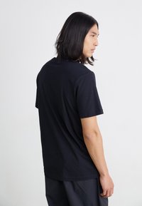Nike Sportswear TEE OPEN - T-shirts print - black