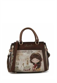 Braune synthetische Handtasche mit einem Cartoon-Mädchen-Design, goldenen Akzenten, zwei oberen Griffen und einem abnehmbaren Schulterriemen.