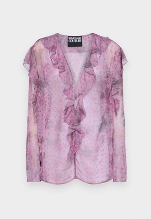 Blusa rosa transparente con bordes rizados, patrón floral y mangas largas. Tejido liviano con escote en V y un diseño fluido.