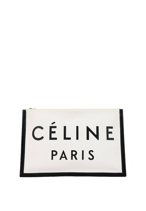 Trousse rectangulaire blanche zippée avec bordure noire, portant l'inscription "CÉLINE PARIS" en lettres noires en gras sur le devant.
