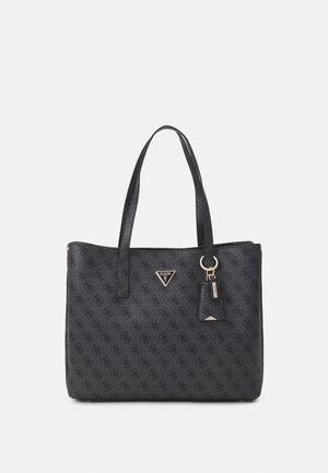 Black Guess tote bag with patterned logo print, two shoulder straps, and a small attached keychain tag.