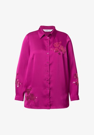 Fuksjowa koszula zapinana na guziki z jedwabiu z długimi rękawami. Posiada hafty kwiatowe w kontrastowych kolorach na przodzie i rękawach.