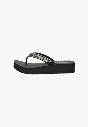 Black flip-flop with a textured sole. Features decorative black and silver floral pattern on the strap. Flat design with a slight heel.