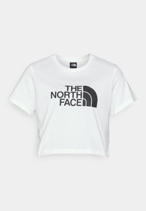 T-shirt court blanc en coton, avec un grand logo noir "THE NORTH FACE" et un graphique emblématique du demi-dôme à l'avant.