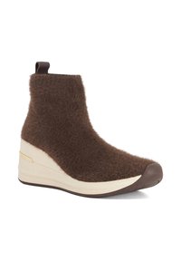 Brown fur ankle boot with a wedge sole, cream midsole, and brown rubber toe cap. Features a pull tab for easy wear.