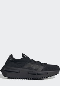 Black athletic shoe featuring a knit upper, molded rubber sole, and three striped accents. Design emphasizes comfort and durability.