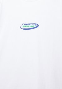 White cotton t-shirt featuring a "Creative Mindset" graphic in blue and green, with a circular design surrounding the text.
