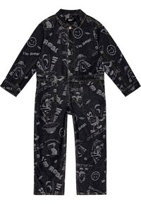 Mörk denimoverall med olika grafiska tryck i grått, långa ärmar, krage och fickor framtill.