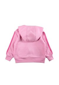 Sweat à capuche rose avec une poche kangourou à l'avant, une capuche ajustable et des bandes latérales contrastantes. Confectionné en tissu doux et texturé avec des poignets côtelés.