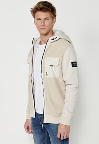 Koroshi Jachetă din fleece - beige