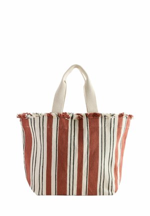 Sac fourre-tout en tissu rayé avec des lignes verticales rouges, blanches et noires, bord supérieur effiloché et deux anses couleur crème.