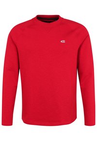 Sweat-shirt rouge à manches longues avec col rond, col en côtes et manches raglan ; présente un petit logo sur la poitrine. Texture de tissu doux.