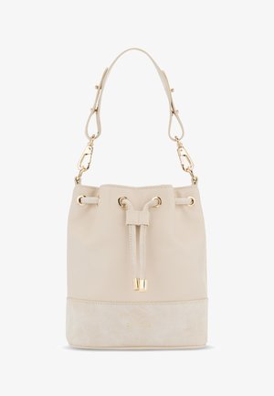 Sac seau beige en matériau synthétique lisse avec une base en daim. Équipé de quincaillerie dorée et de bandes réglables, fermeture à cordon.