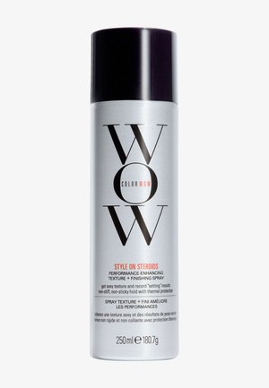 Sølv cylindrisk spraydåse med sort hætte mærket "WOW Color Wow Style on Steroids" hårtekstur- og finishspray, 250 ml.