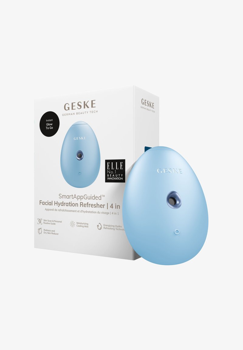 A blue, egg-shaped facial hydration refresher with a front button and textured areas, packaged in a white box featuring black and gold details.