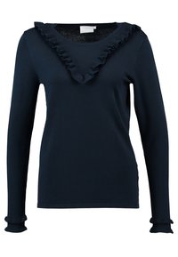 Mörkblå långärmad top i stickad textil med en volangkantad V-ringning och volangdetaljer vid ärmsluten. Mjuk textur överallt.