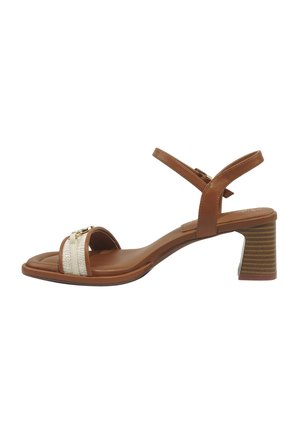 Brown heeled sandal with ankle strap, block heel, and front strap featuring cream and gold zipper detail.