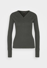 Grünes Langarm-Henley-Shirt mit gerippter Textur, V-Ausschnitt, dreifachem Knopfverschluss und taillierter Passform, mit verlängerten Bündchen.