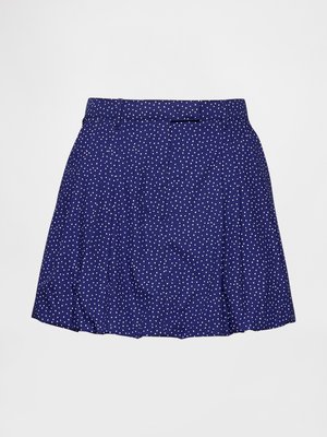 Blue skirt featuring a polka dot pattern in white, with a pleated design and a flat waistband. Made from lightweight fabric for ease of movement.