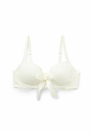 Lace-trimmed bra in ivory with molded cups, featuring a satin bow at the center, adjustable straps, and floral embossed pattern.