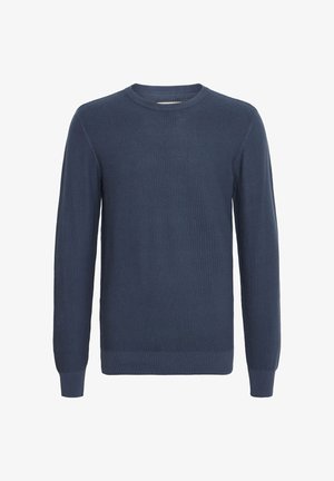 Tumed sinine kudumiga sviiter ümmarguse kaelusega ja pikkade varrukatega, millel on tekstuuriline muster ning ribatud randmed ja alumine äär.