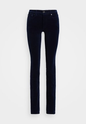 Pantalones de pana azul oscuro de corte ajustado con botón frontal, cierre de cremallera y bolsillos laterales y traseros, exhibidos sobre un fondo blanco.