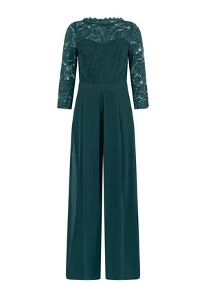 Smaragdgroene jumpsuit met lange kanten mouwen, bloemenkant lijfje, getailleerde taille en wijde, op maat gemaakte broekspijpen.