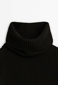Black ribbed turtleneck sweater featuring a high collar and textured knit pattern, emphasizing warmth and a snug fit.