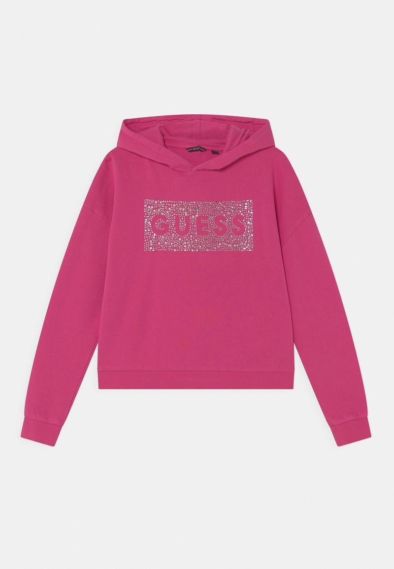 Fuchsia hooded sweatshirt made of cotton blend, featuring a glittered "GUESS" logo within a rectangular design. Cropped length, ribbed cuffs.
