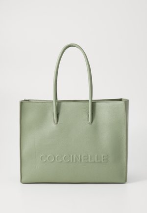 Green leather tote bag with a textured finish, featuring two sturdy handles and embossed "COCCINELLE" logo on the front.
