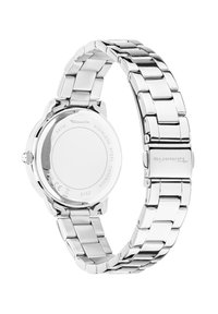 Edelstahlarmbanduhr mit einem silbernen, metallischen Armband, rundem Gehäuse und glattem Lünette. Hinweise auf der Gehäuseunterseite zeigen die Wasserbeständigkeit an.