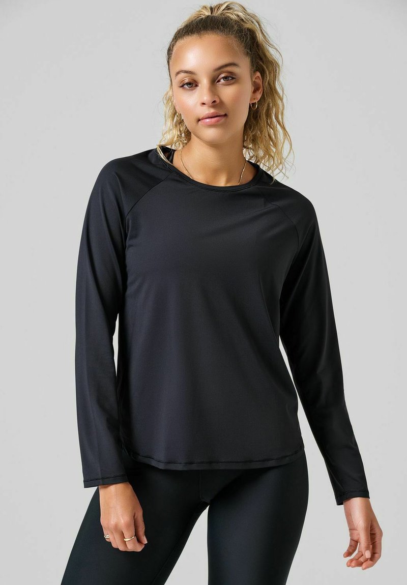 Zwarte lange mouwen sportshirt met een ronde hals en raglanmouwen, gemaakt van soepel, lichtgewicht materiaal met een iets getailleerd ontwerp.